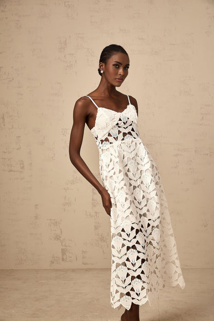 A white midi dress with lace detailing and cutout design named Delphine