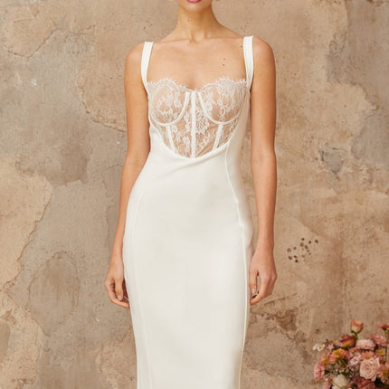 A white midi dress with lace panels and a corsetstyle bodice