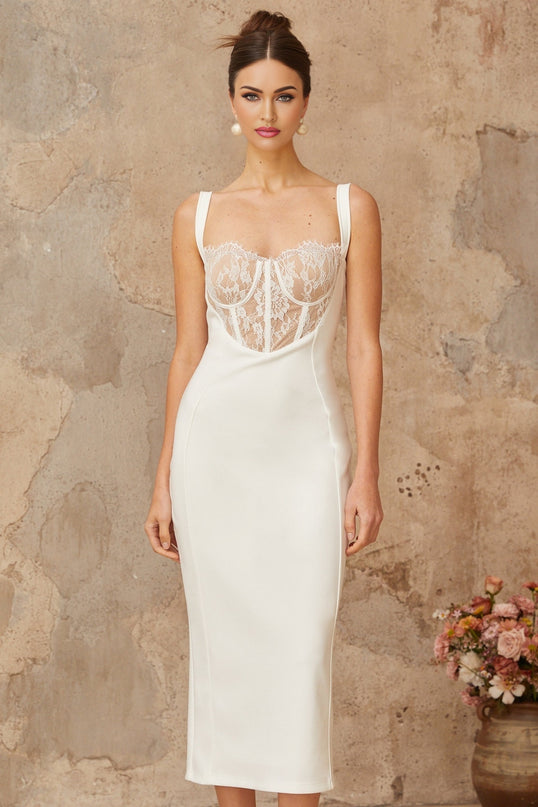 A white midi dress with lace panels and a corsetstyle bodice