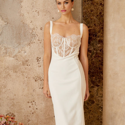 A white midi dress with lace panels and corsetstyle bodice featuring a fitted silhouette and delicate feminine design