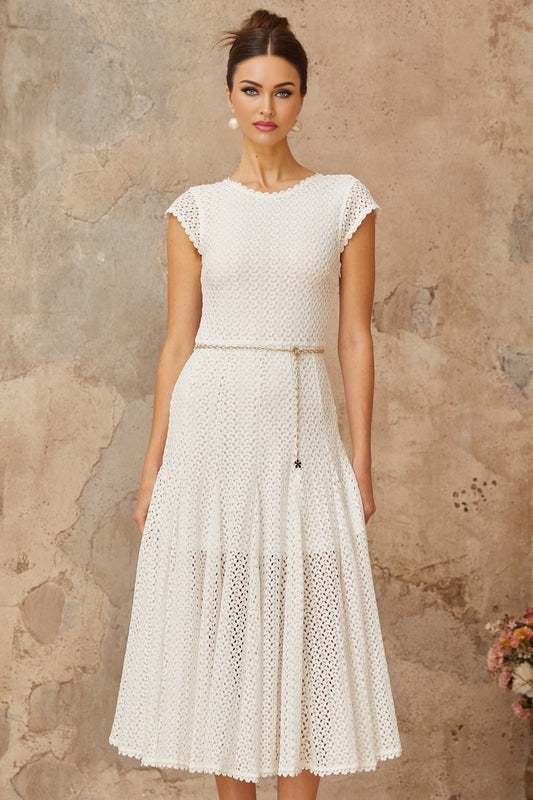 A white midi dress with shirred detailing and crochet knit pattern featuring a fitted bodice and flowy skirt