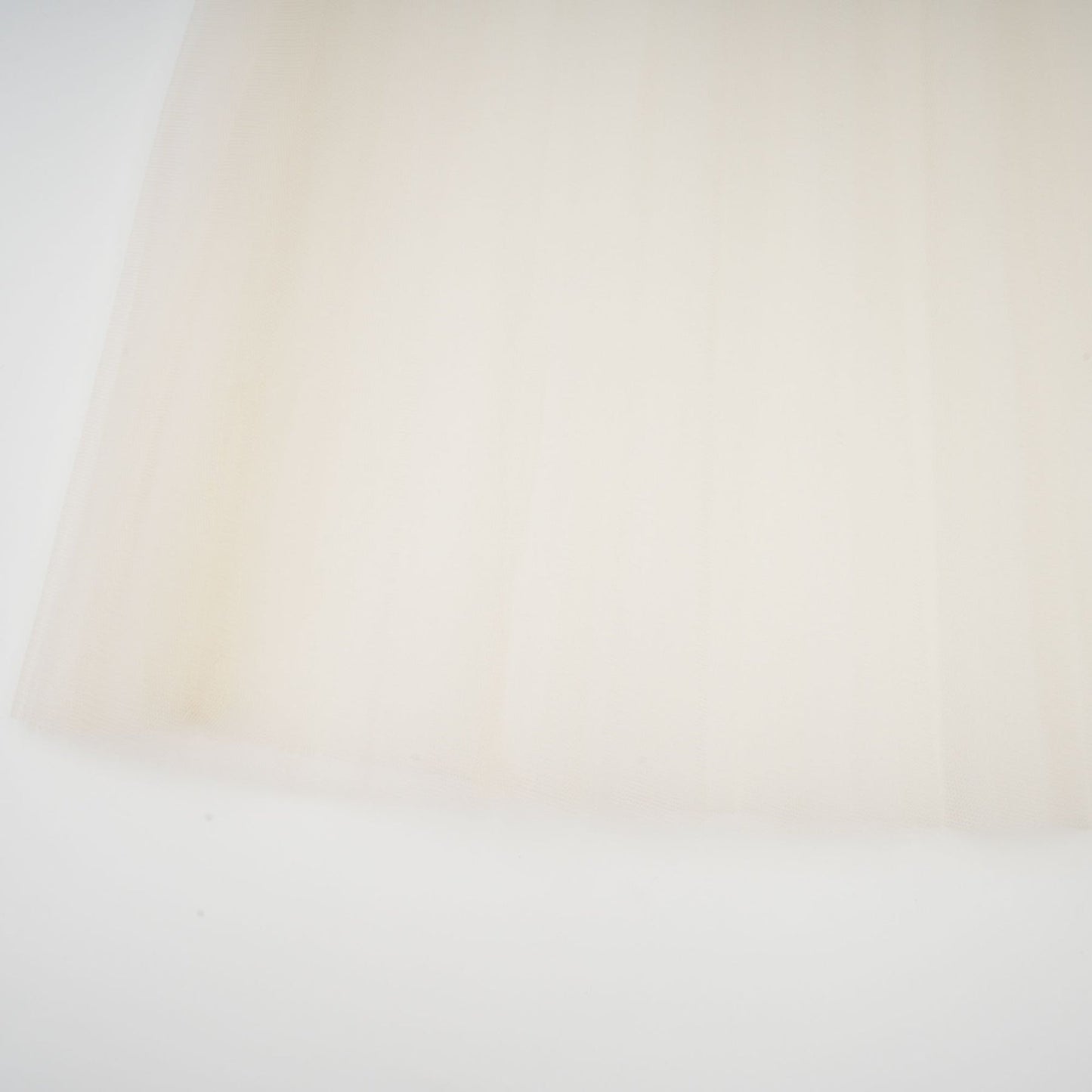 A white midi dress with tulle panels and a bowknot detail named Therese
