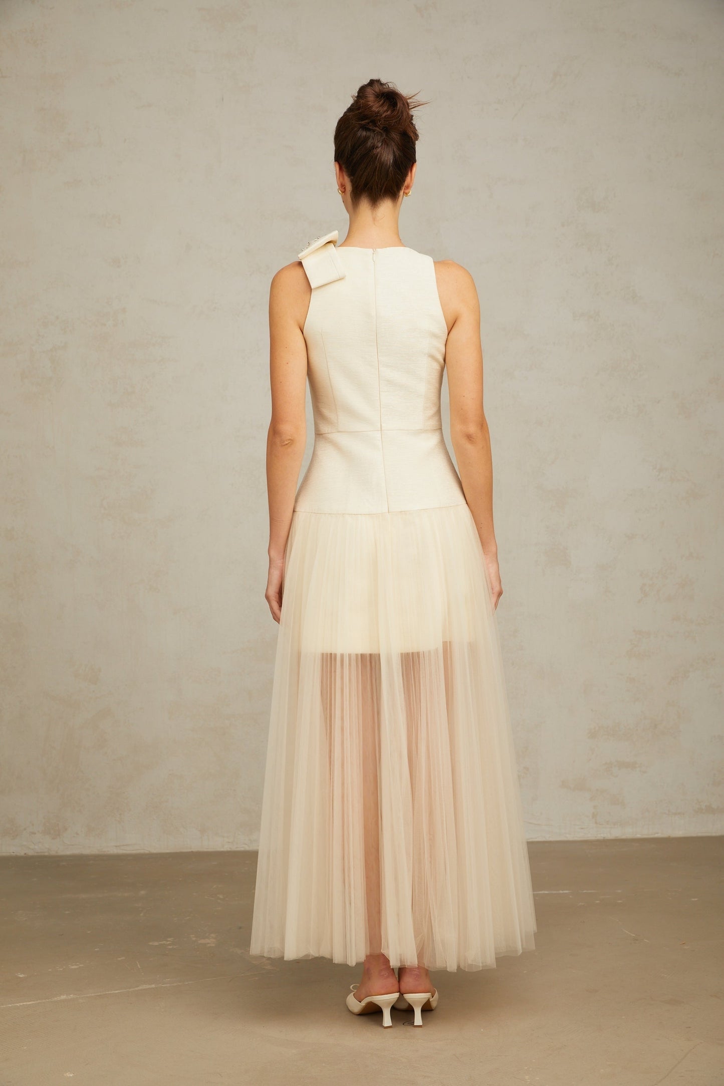 A white midi dress with tulle panels and a bowknot detail named Therese