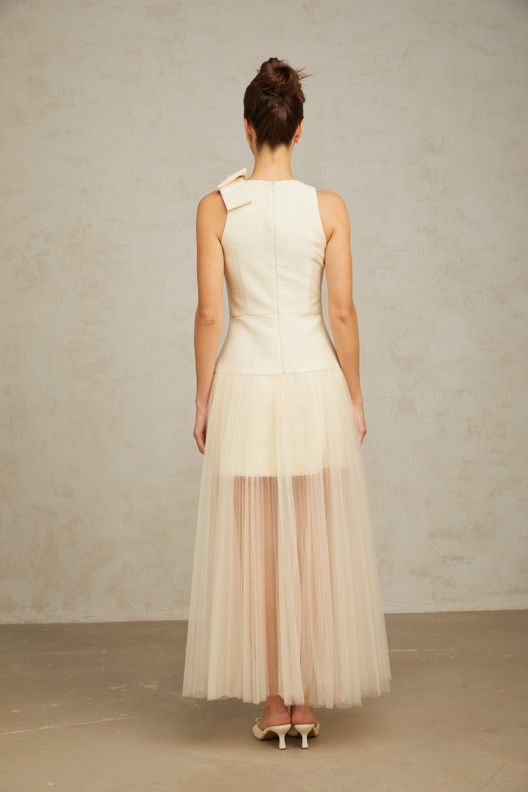 A white midi dress with tulle panels and a bowknot detail named Therese