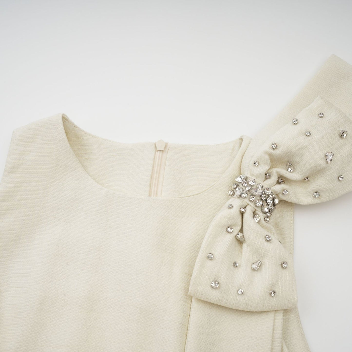 A white midi dress with tulle panels and a bowknot detail named Therese