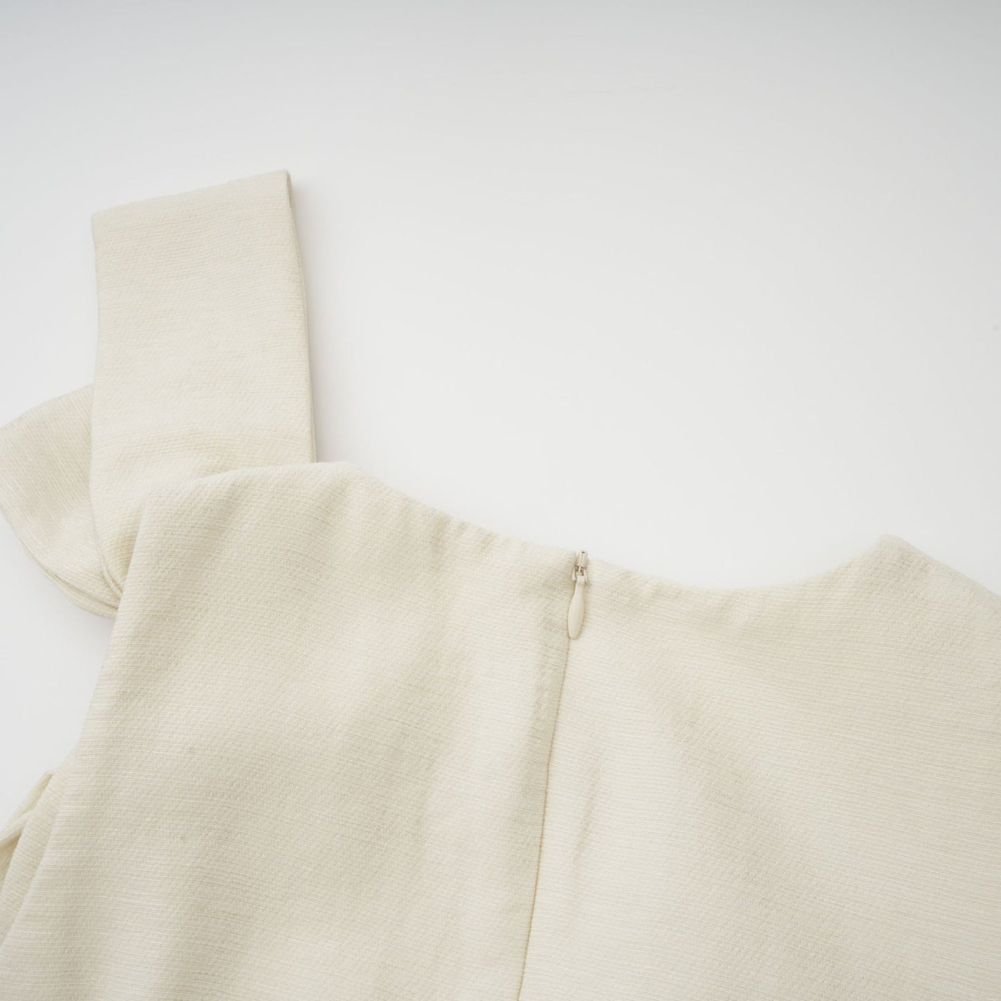 A white midi dress with tulle panels and a decorative bowknot detail named Therese