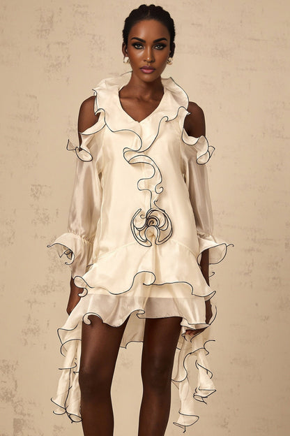 A white mini dress with flounce detailing and ribbon accents named Tiphaine