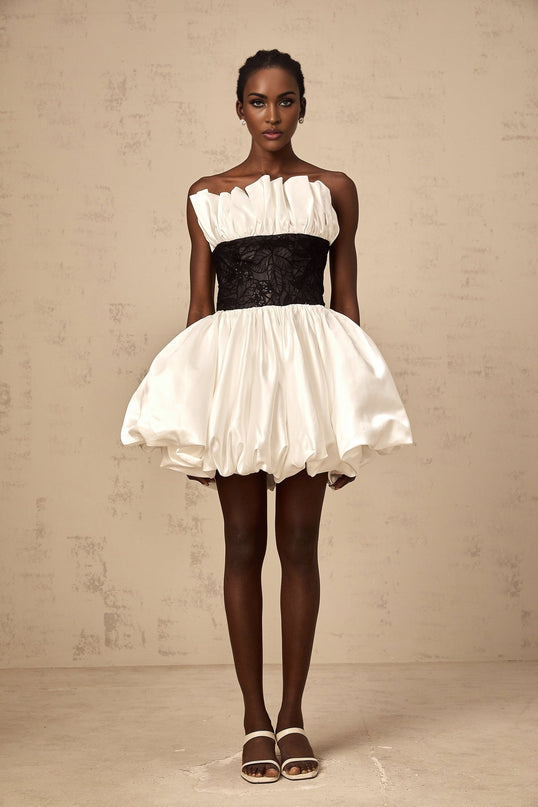 A white mini dress with puff sleeves and lace panelling details made from satin fabric named Éliane