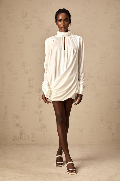 A white mini dress with ruched details and faux flower embellishments named Maeva
