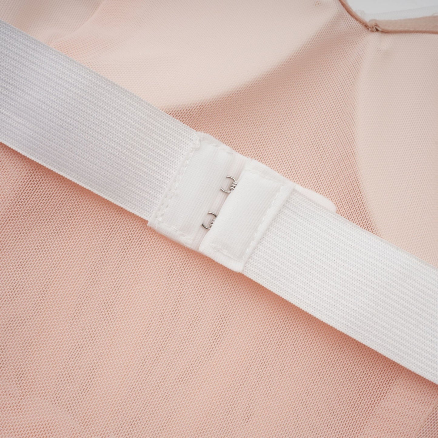 A white offshoulder maxi dress with embellishments named Margot worn by a model against a plain background