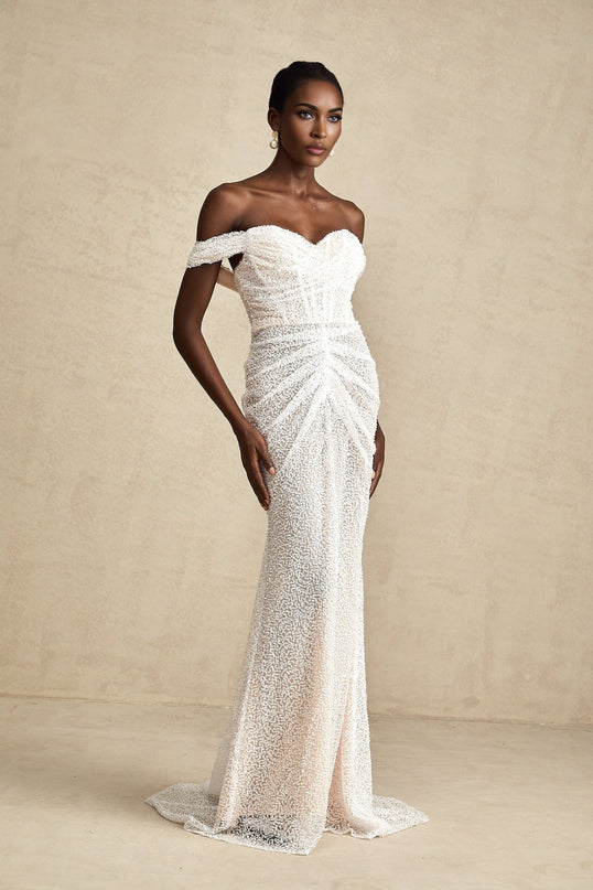 A white offshoulder maxi dress with embellishments named Margot