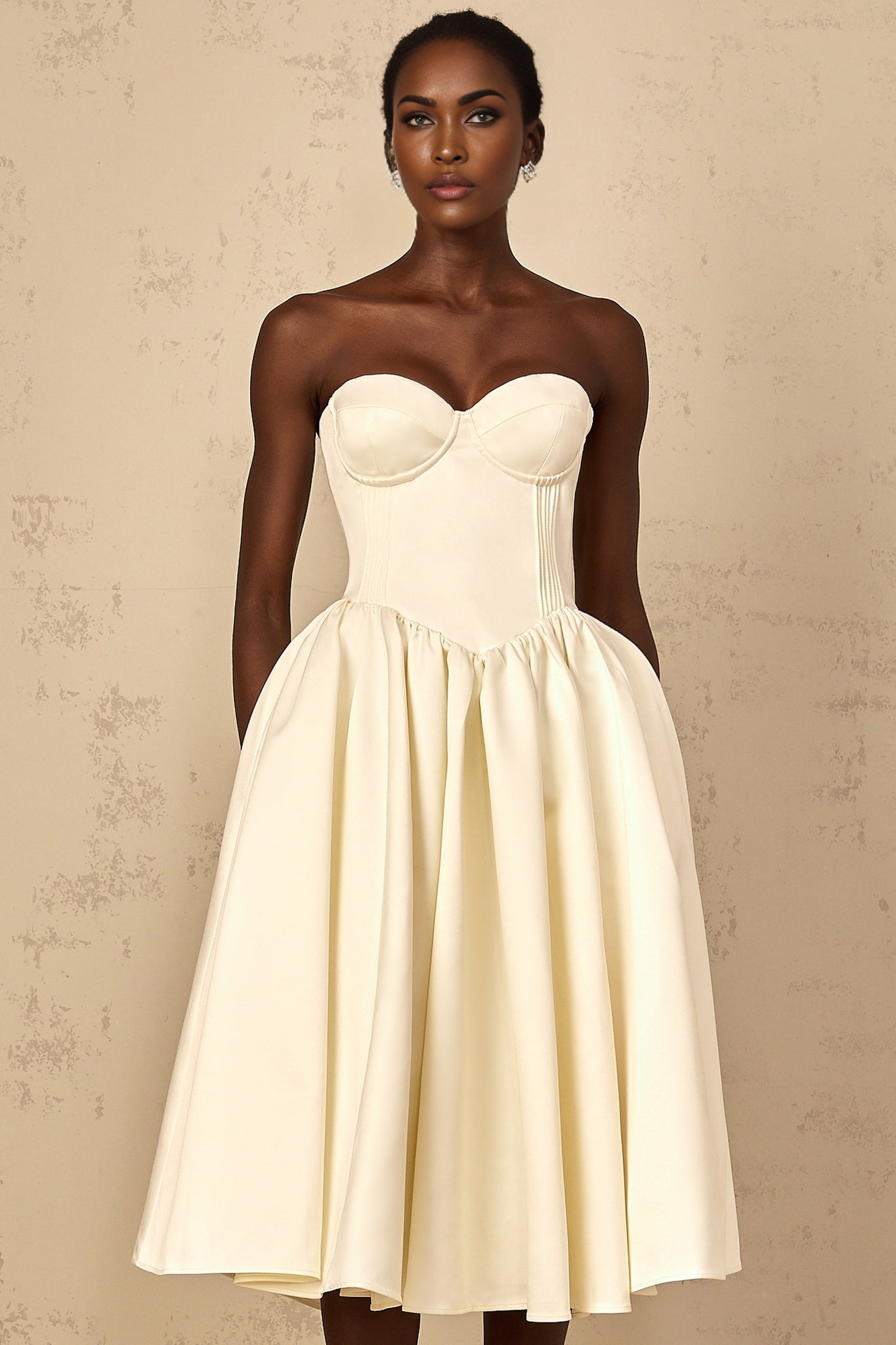 A white offshoulder midi dress for women with shirred detailing featuring a fitted bodice and flowy skirt