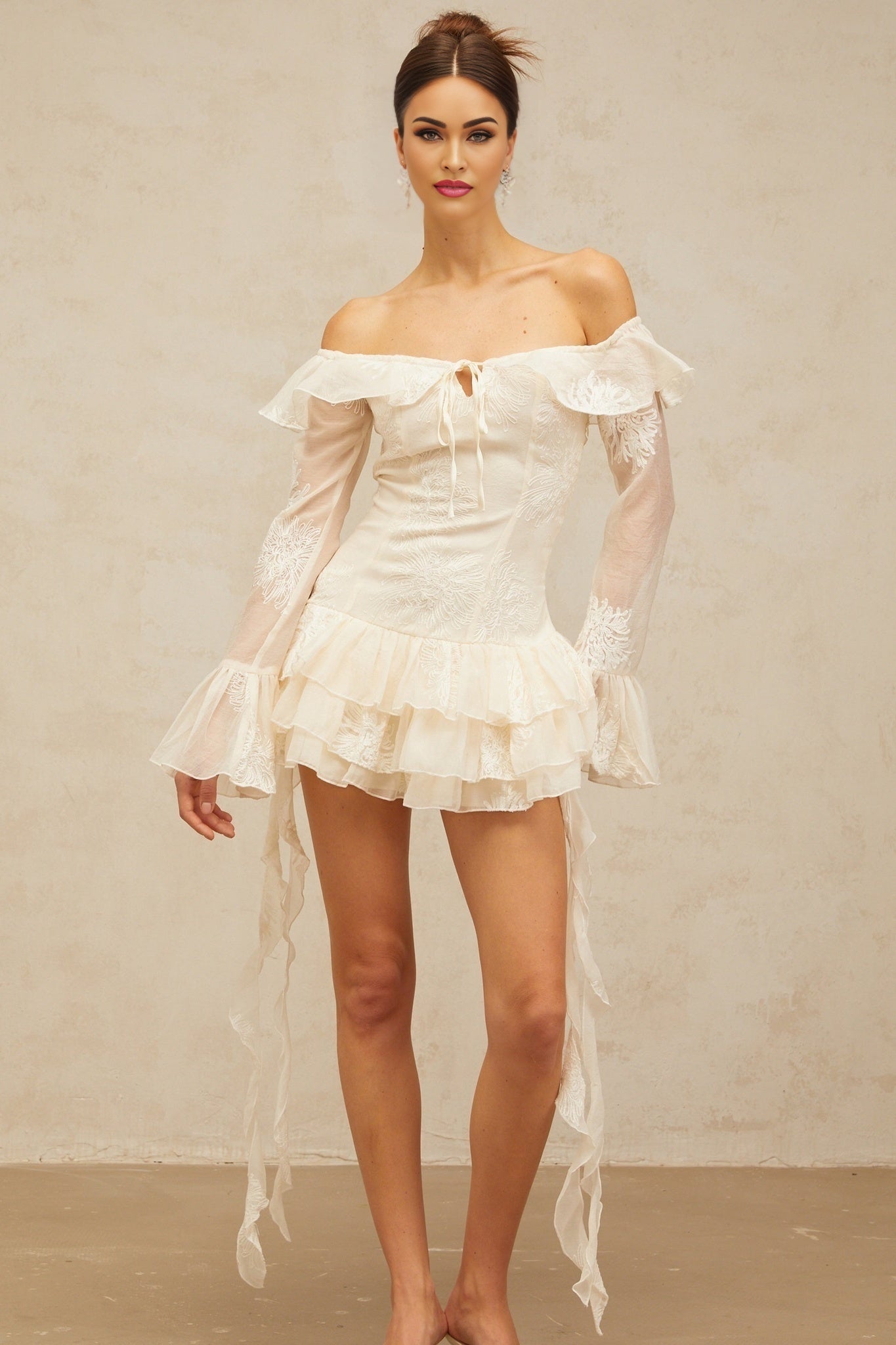 A white offshoulder mini dress with embroidery details named Desiree