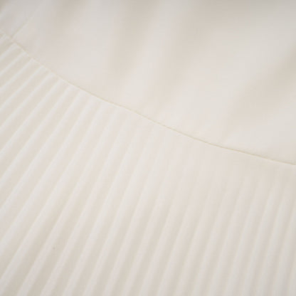 A white pleated jacket and dress set with embellishments The jacket features decorative details and the dress has a matching pleated design Both pieces are shown together as a coordinated outfit