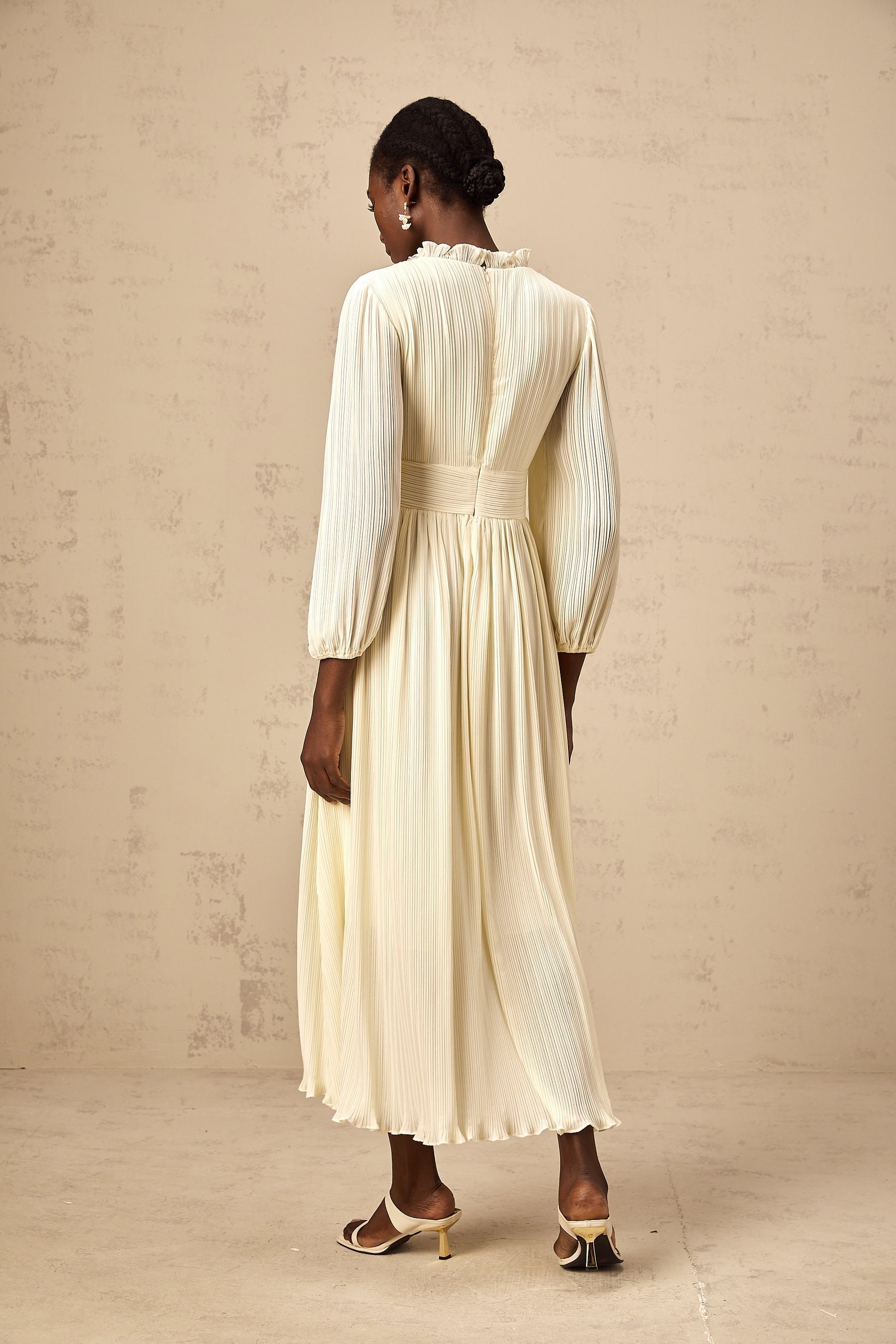 A white pleated midi dress with crystal trim detail named Yana