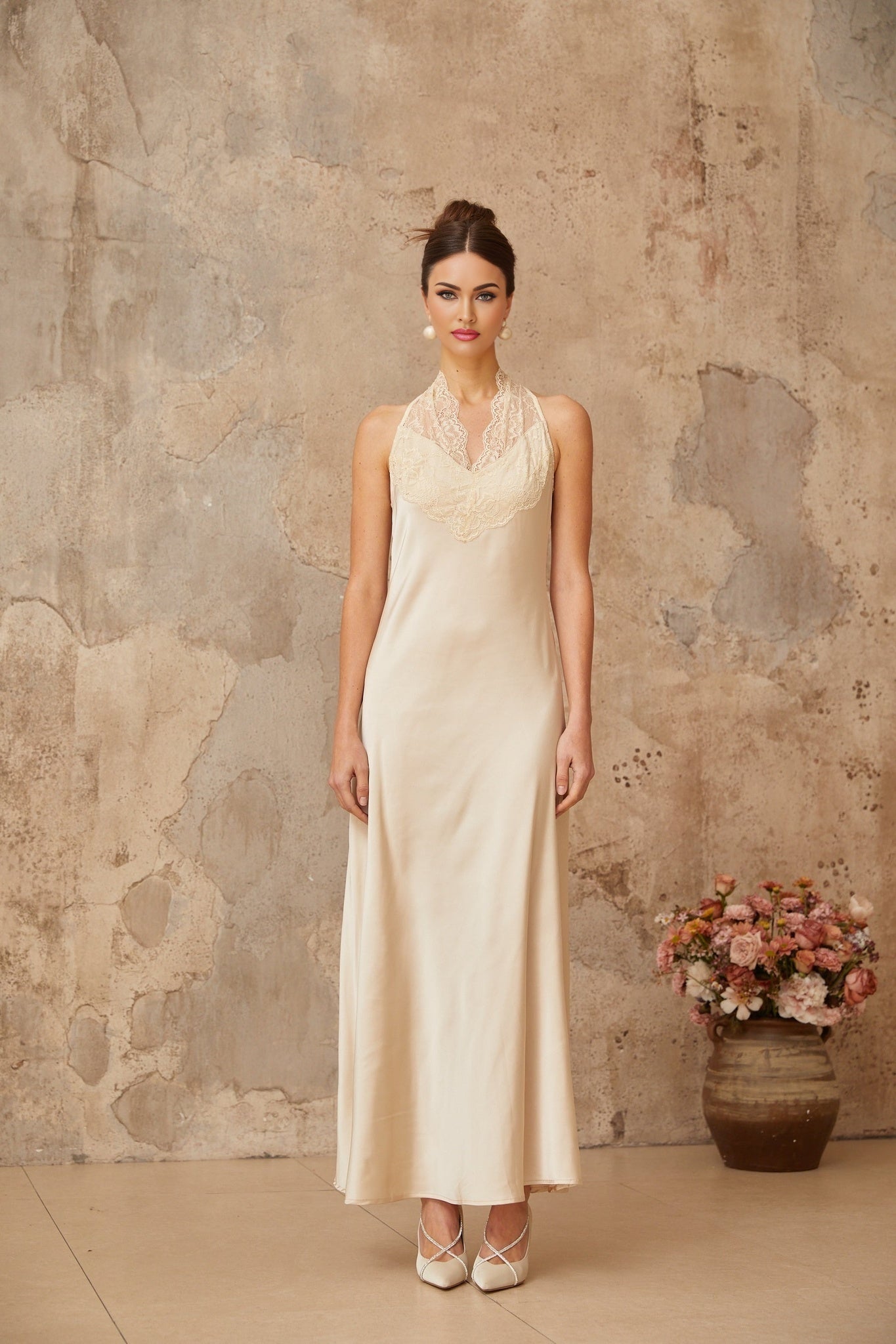 A white satin maxi dress for women featuring lace trim details