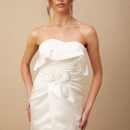 A white satin maxi dress with floral applique details named Anna