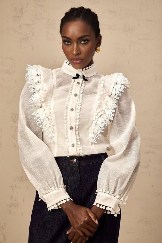 A white semisheer shirt with delicate lace trim details named Capucine