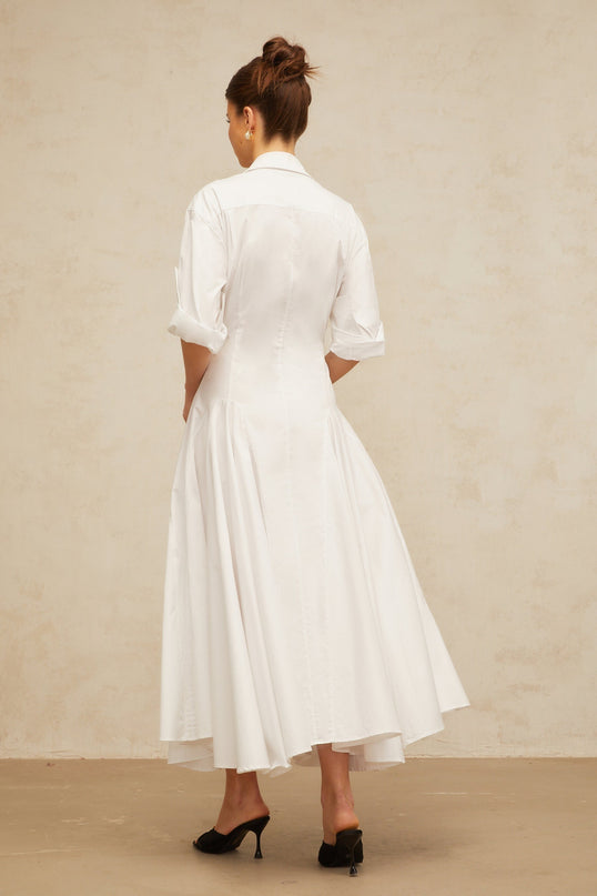 A white shirt dress with a front slit and shirred detailing named Dulcie