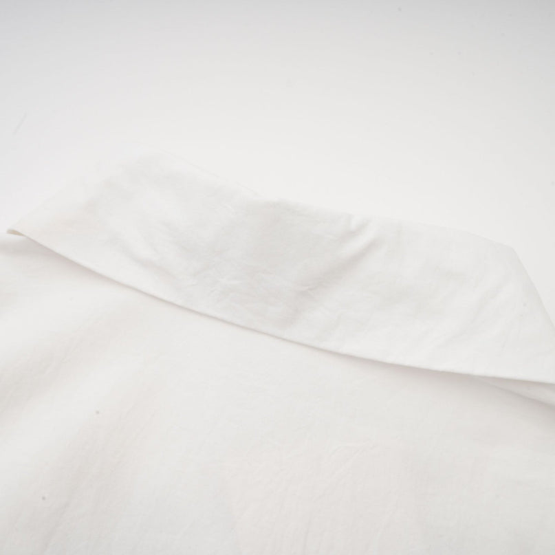 A white shirt with floral cutout patterns and a feminine design named Rosalie