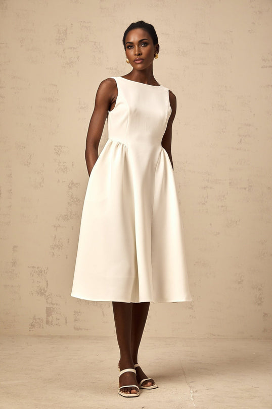 A white sleeveless midi dress with a full skirt named Yolanda
