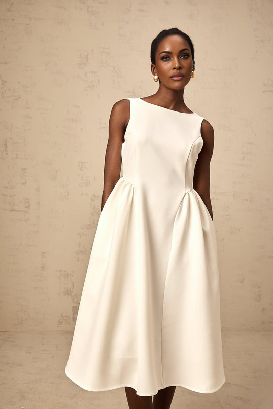 A white sleeveless midi dress with a full skirt named Yolanda