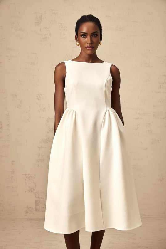 A white sleeveless midi dress with a full skirt named Yolanda