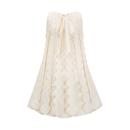 A white sleeveless mini dress with wavy details called Axelle