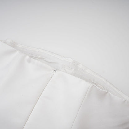 A white strapless mini dress with a corsetstyle bodice adorned with floral petal details named Lucie