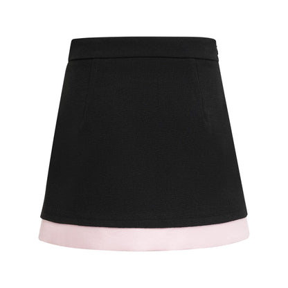 Black tweed dress with notched lapels cinched waist front bowknot detailing and contrast colors