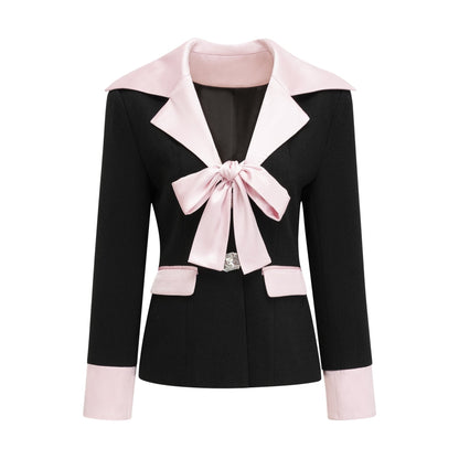 Black tweed dress with notched lapels cinched waist front bowknot detailing and contrast colors Composed of 100% tweed fabric