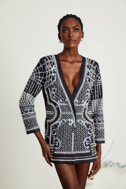 A woman wearing a blazer dress with a Catherine pattern print and Vneck design