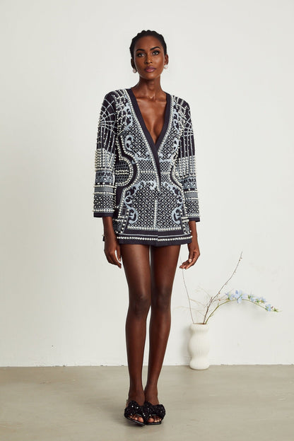 A woman wearing a blazer dress with a Catherine pattern print and Vneck design