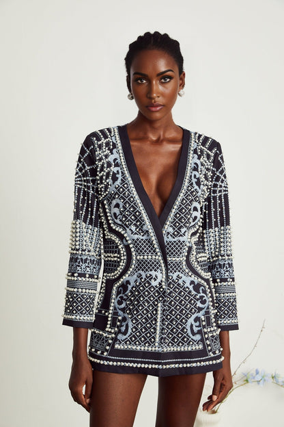 A woman wearing a blazer dress with a Vneck and Catherine pattern print
