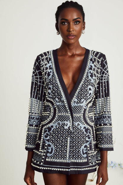 A woman wearing a blazer dress with a Vneck and Catherine pattern print