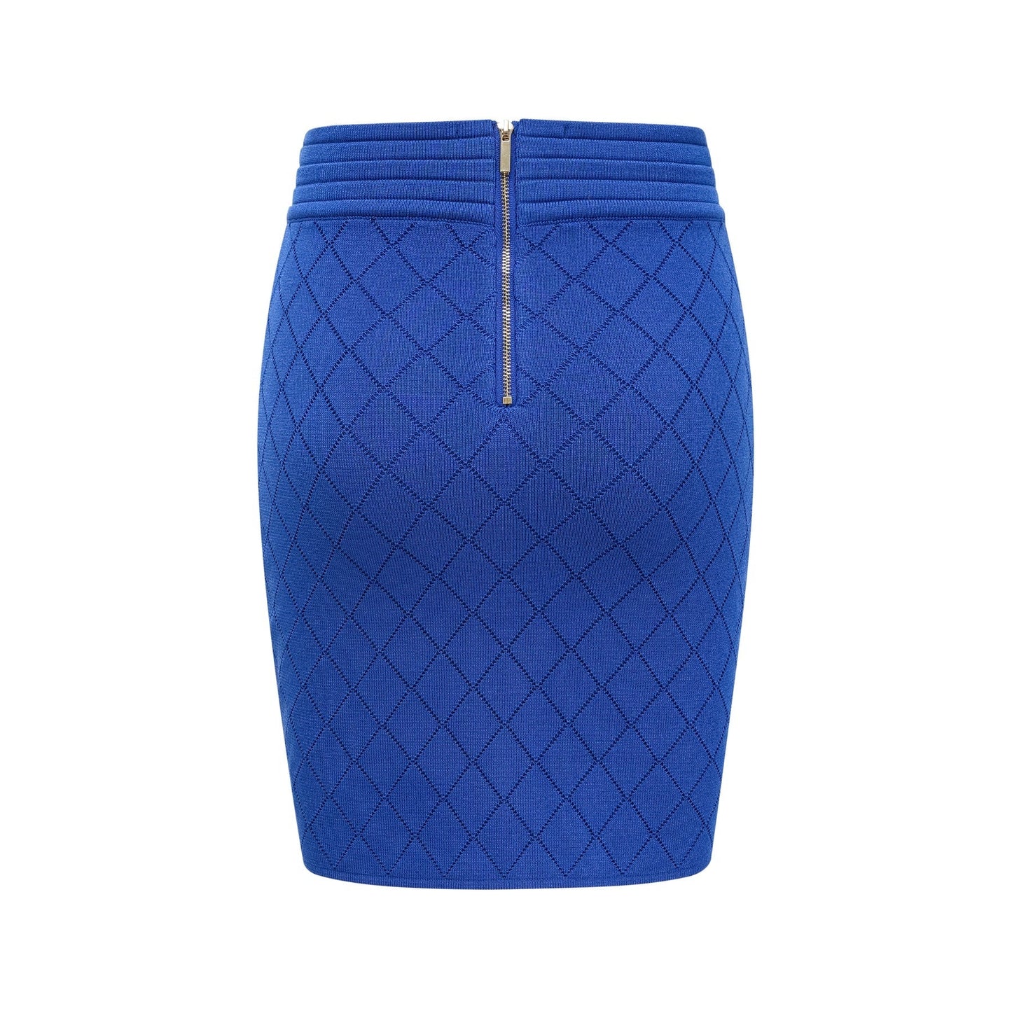 A woman wearing a blue knitted matching set consisting of a top with button details and a skirt