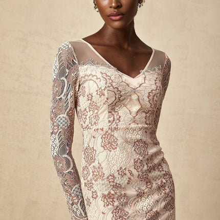 A woman wearing a fitted midi dress made of Anna guipure lace standing in a simple pose against a plain background