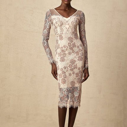 A woman wearing a fitted midi dress made of Anna guipure lace standing in an elegant pose