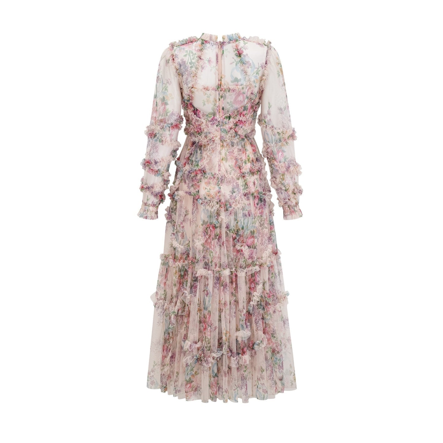 A woman wearing a floral patterned midi dress with ruffled details and a tulle skirt standing in a relaxed pose
