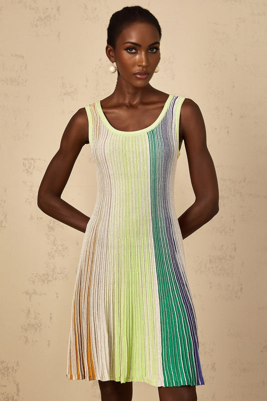 A woman wearing a green mini dress with sequin stripes and a knit texture
