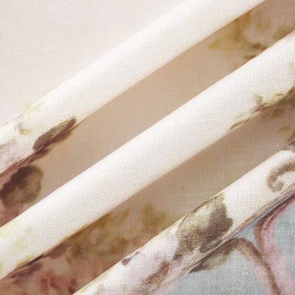 A woman wearing a long sleeve boho style dress with a floral print pattern The dress features a flowing skirt and bohemian inspired design in soft colors