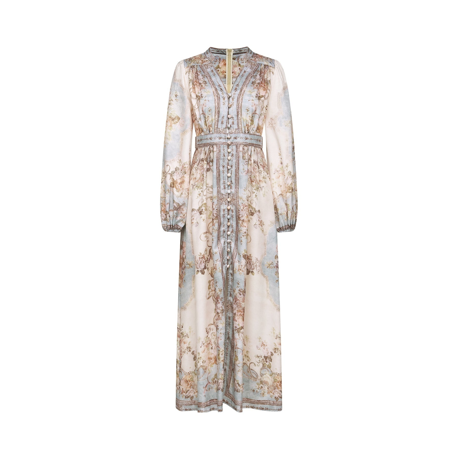 A woman wearing a long sleeve floral print boho dress with a flowing skirt and feminine silhouette in a nature inspired setting