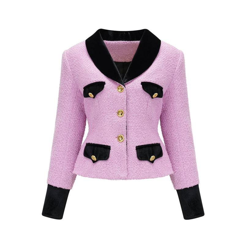 A woman wearing a matching blazer and skirt set in a professional style