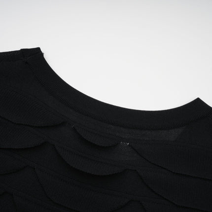 A woman wearing a snakepattern midi dress with godet inserts for a flared silhouette the dress features a fitted bodice and long sleeves