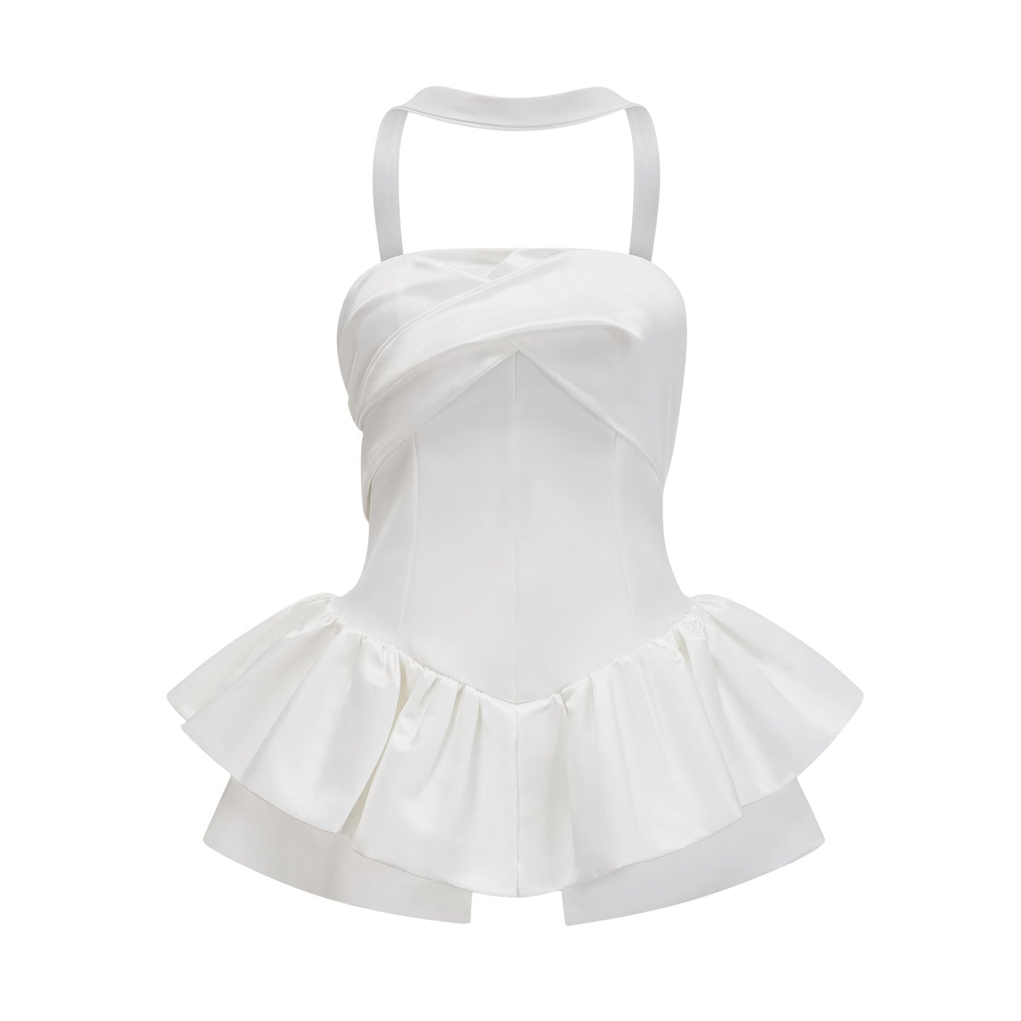 A woman wearing a white halterneck mini dress with ruffled details standing against a plain background