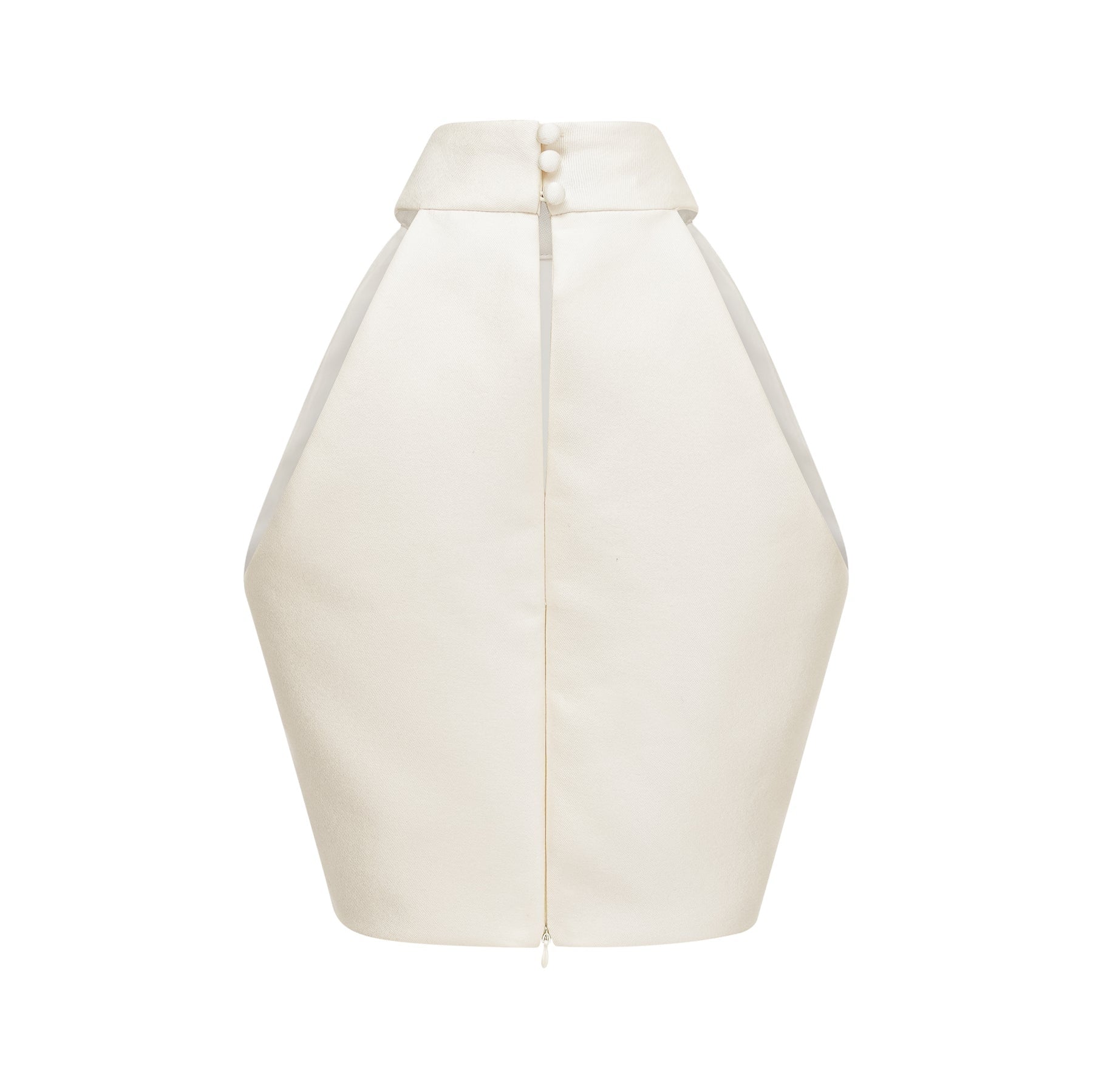 A woman wearing a white sleeveless top paired with a matching white skirt creating a coordinated outfit set