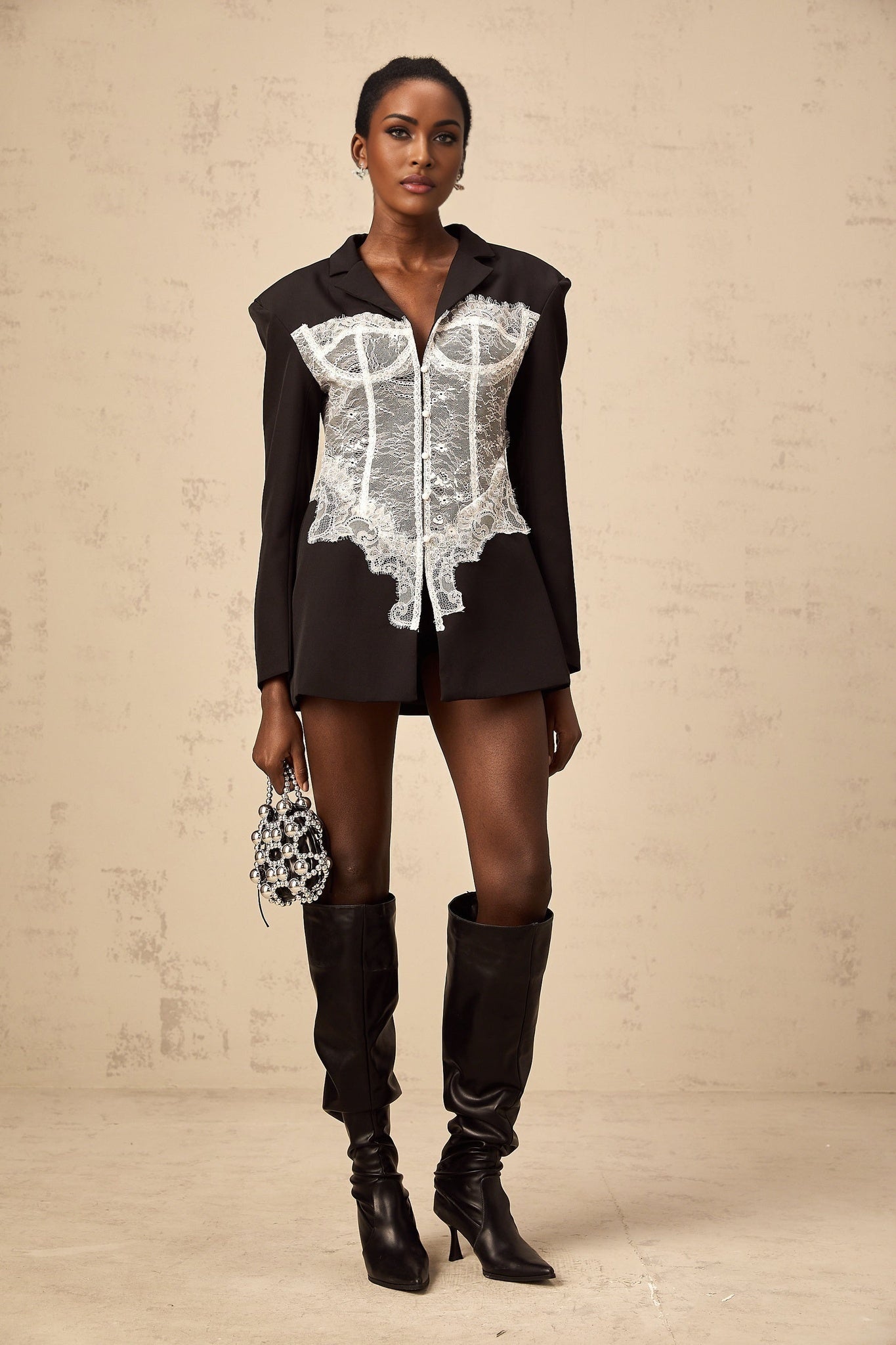 A womens blazer featuring color block design and lace panels named Alexia