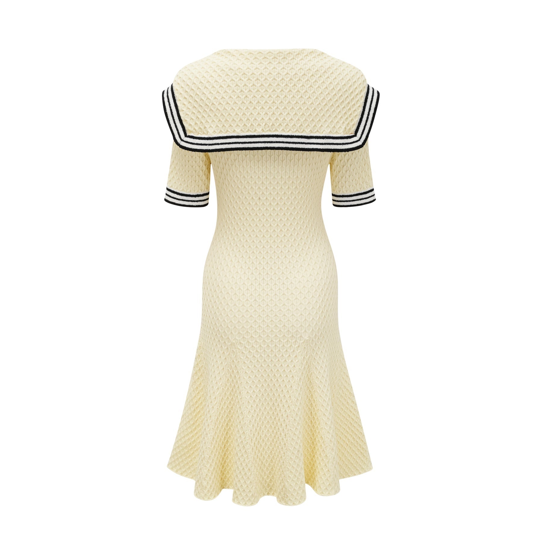 A yellow knitted dress with a sailor collar featuring a Madeleine style design