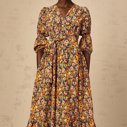 A yellow midi dress with a floral print and Vneck design called Eliane