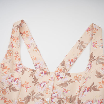 A yellow midi dress with a floral print pattern and button details